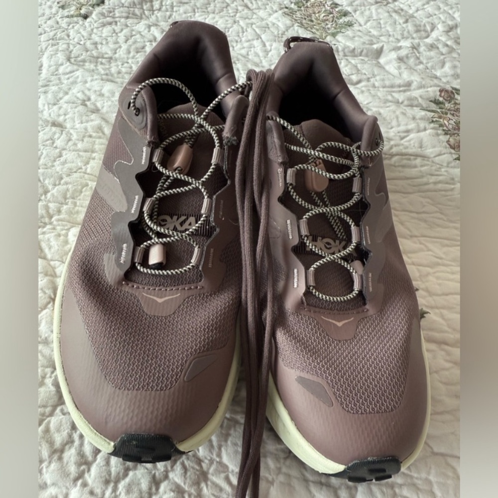 Hoka Transport and Purple Sneakers with Modern Design